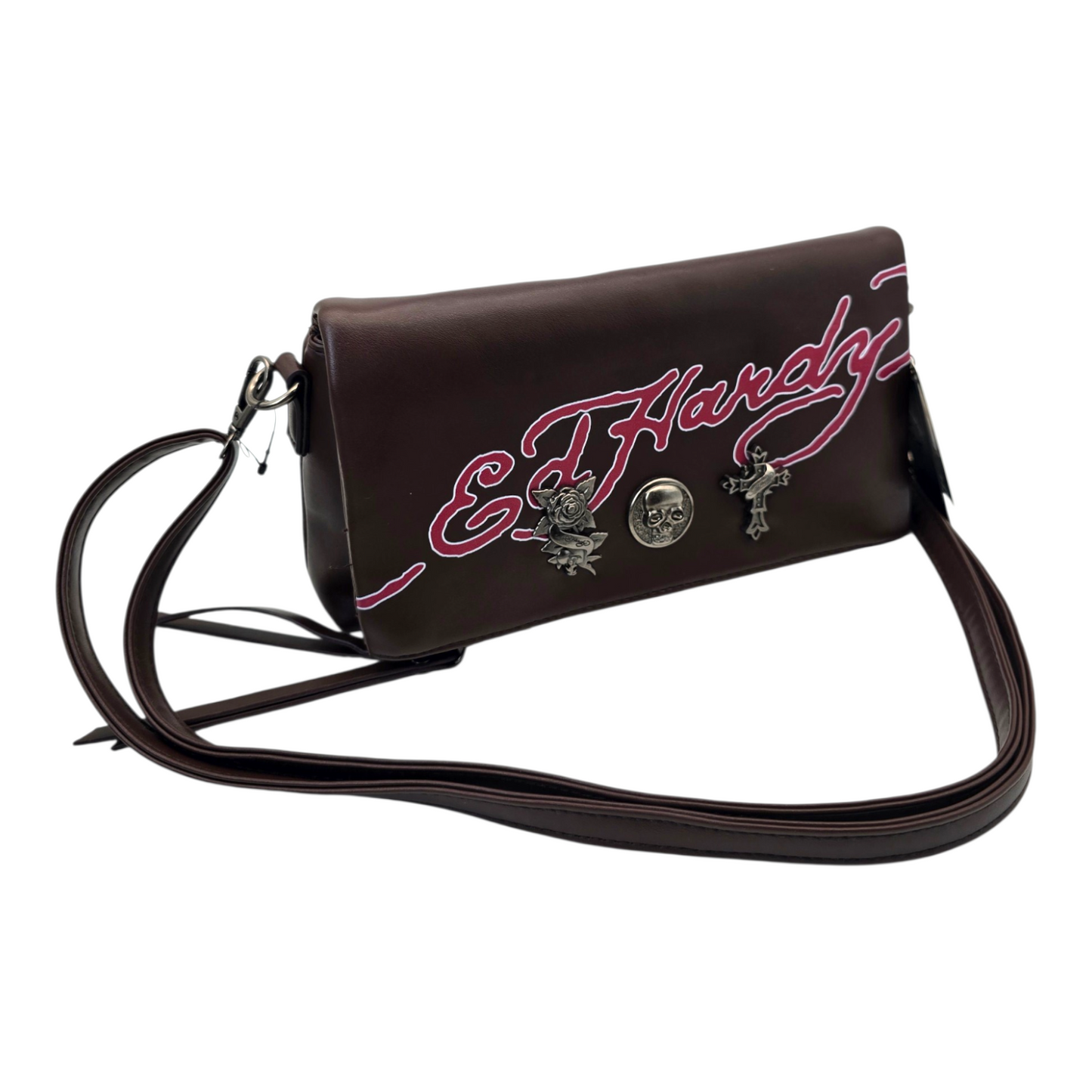 Bolsa Clutch sobre café Ed Hardy